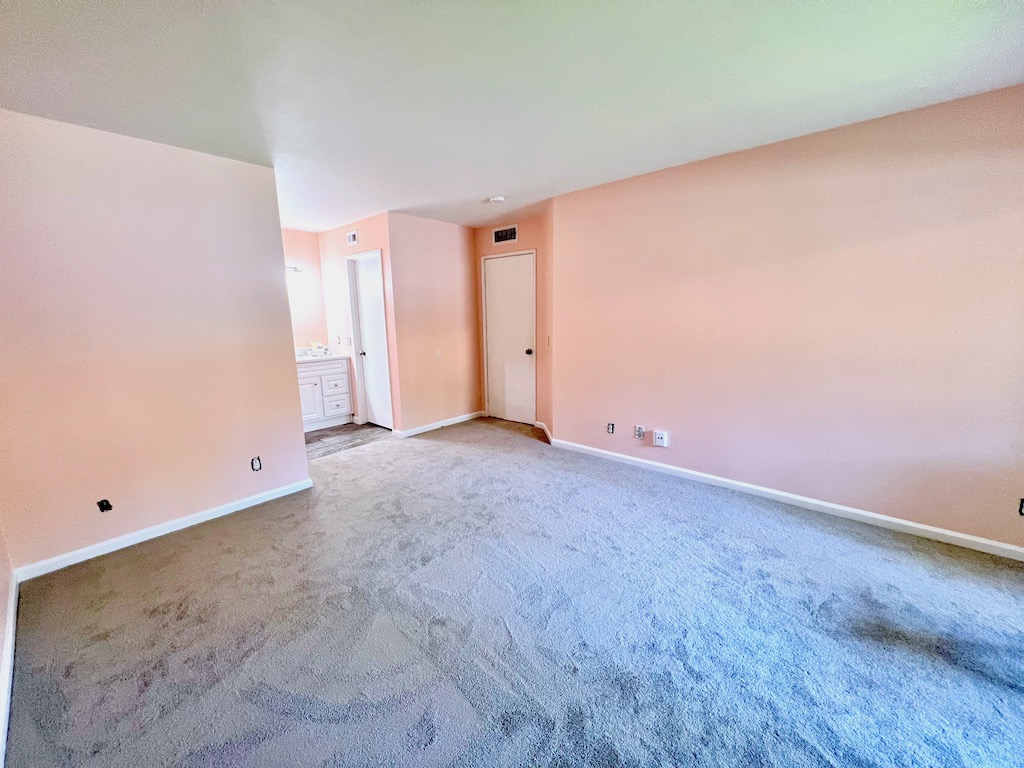 Pink walls, white ceilings, neutral colored carpet